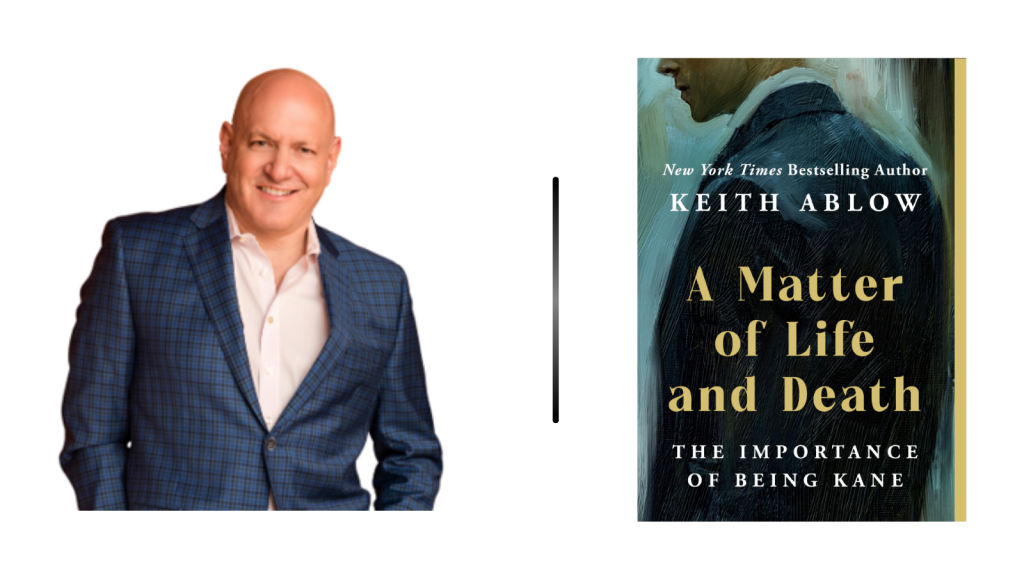 Smiling man in a blue checkered blazer on the left, a tall black divider, and a book cover titled 'A Matter of Life and Death: The Importance of Being Kane' on the right by Keith Ablow